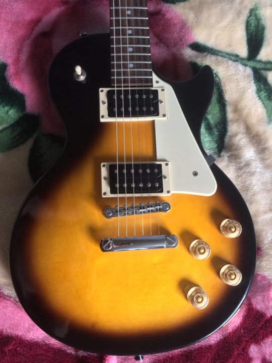 Epiphone les paul 100. Эпифон лес пол 100. Epiphone les Paul 100 трещина на грифе.