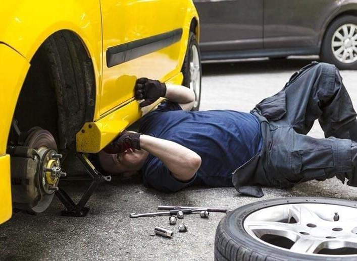 He is Mending his car