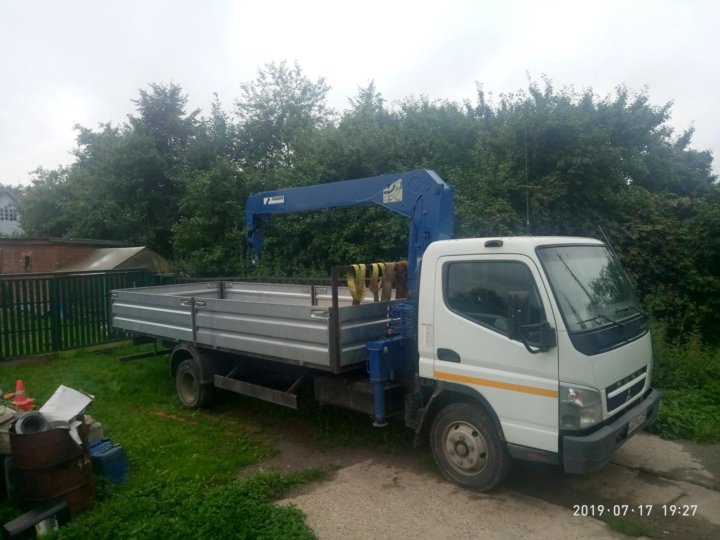 Услуги манипулятора в чехове. Перевозка колец жб в легковом прицепе