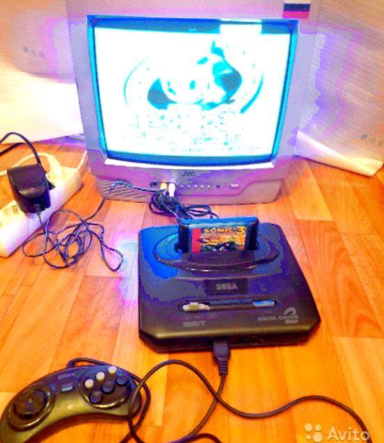 Сега игра телевизор. Игровая приставка Sega Mega Drive 2. Игровая приставка сега сега мегадрайв 2. Приставка игровая сега мега драйв к телевизору. Приставка сега 2022.
