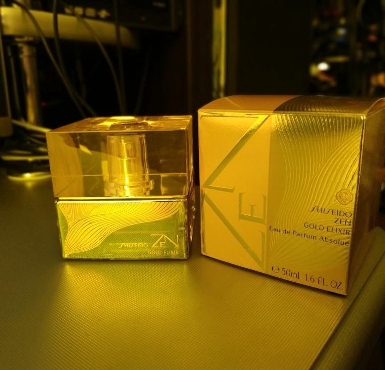 Шисейдо зен отзывы. Shiseido Zen Gold Elixir. Zen Gold Shiseido 50 мл. Shiseido Parfum Gold. Шисейдо Зен реклама.