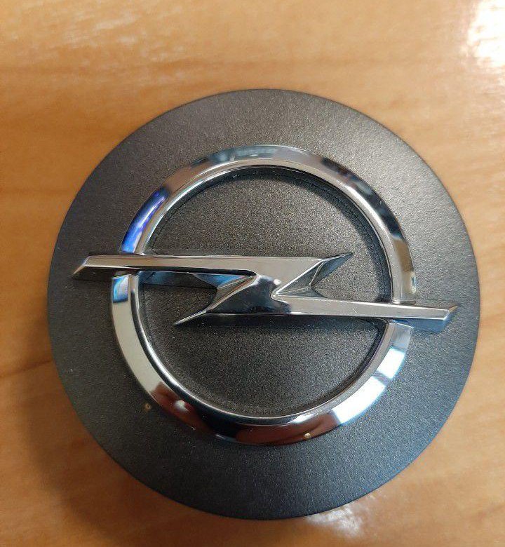 колпачки в ступицу опель инсигния. заглушка ступицы опель инсигния. колпачки опель. колпачок литого диска opel 90 576 630ej. заглушки ступицы на опель astra h.